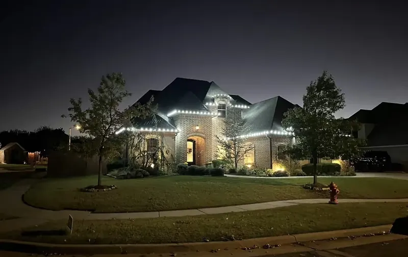 Brick two-story home in pure white bulbs